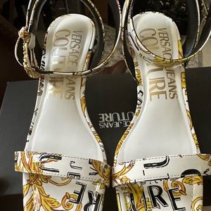 Versace sandals size 7 black , white and gold.